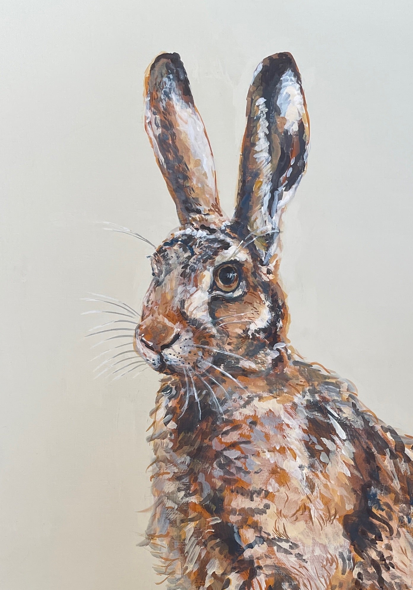 Hares are so athletic with their powerful hind legs ready to propel them off into the distance. There is something magical about catching a glimpse of a hare.  This painting has an off-white background.