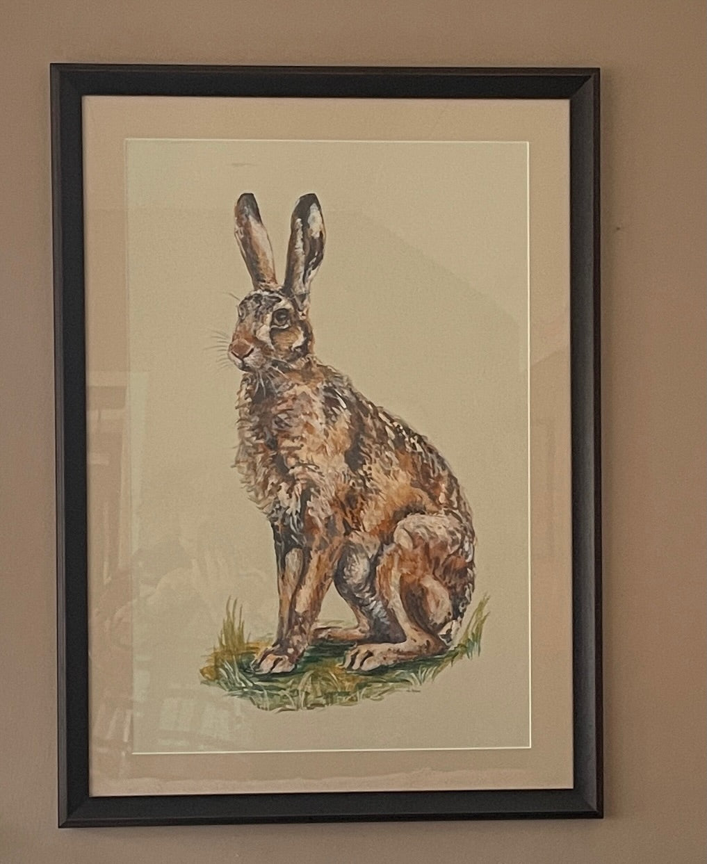 Hares are so athletic with their powerful hind legs ready to propel them off into the distance. There is something magical about catching a glimpse of a hare. This painting has an off-white background.