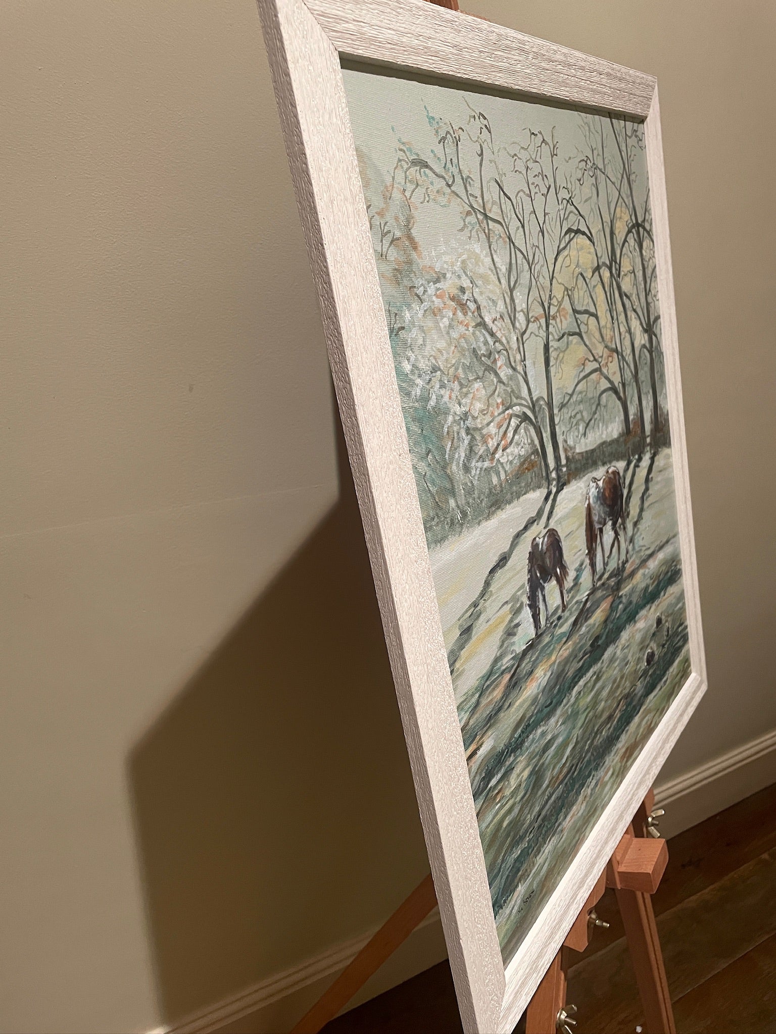 This painting features two hares in a heart shaped composition. These characterful hares have been spied before they leap across the countryside meadow.