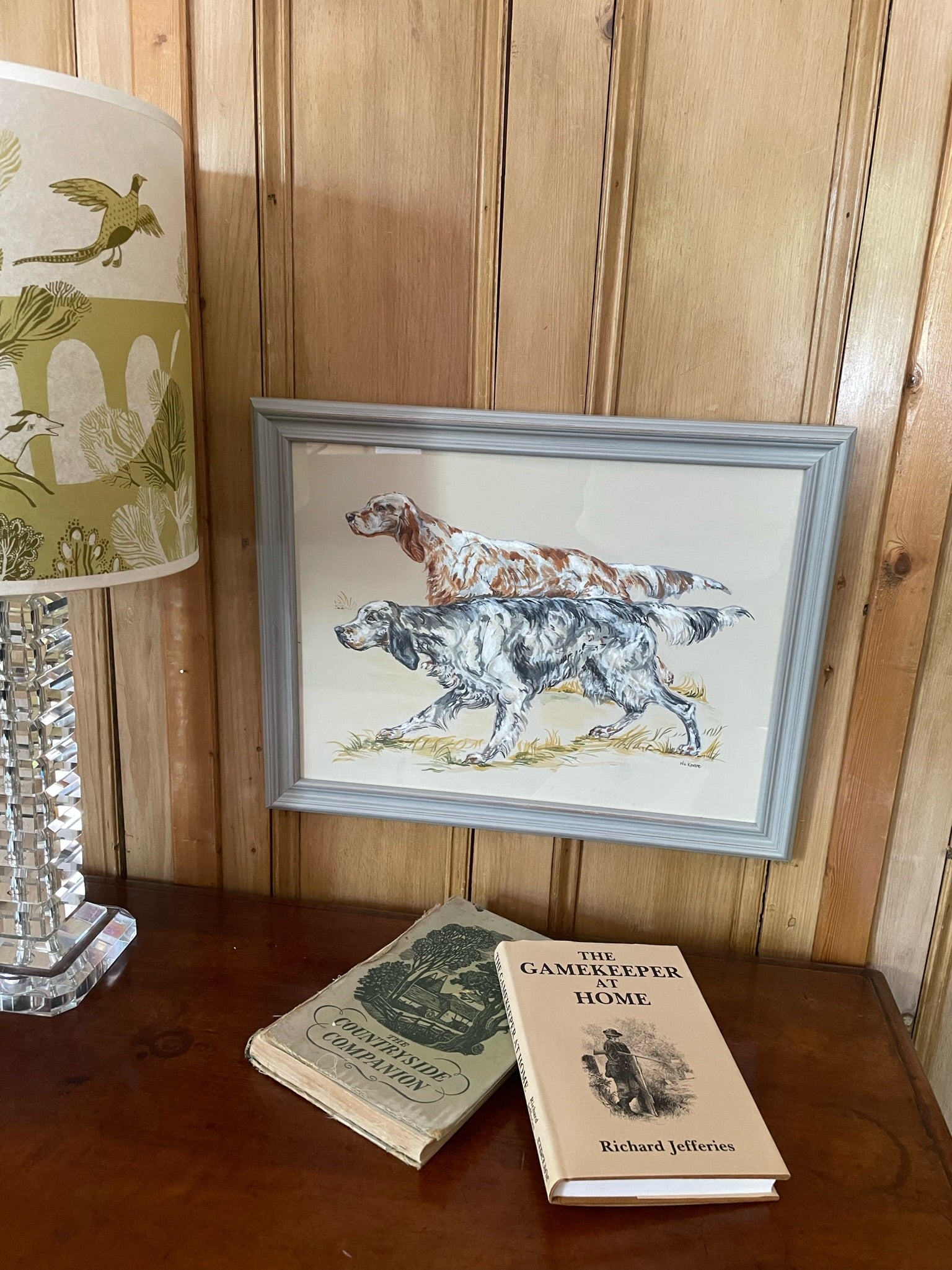English Setters - two traditional gundogs hunting. A painting of a working dog breed inspired by old country sporting prints.