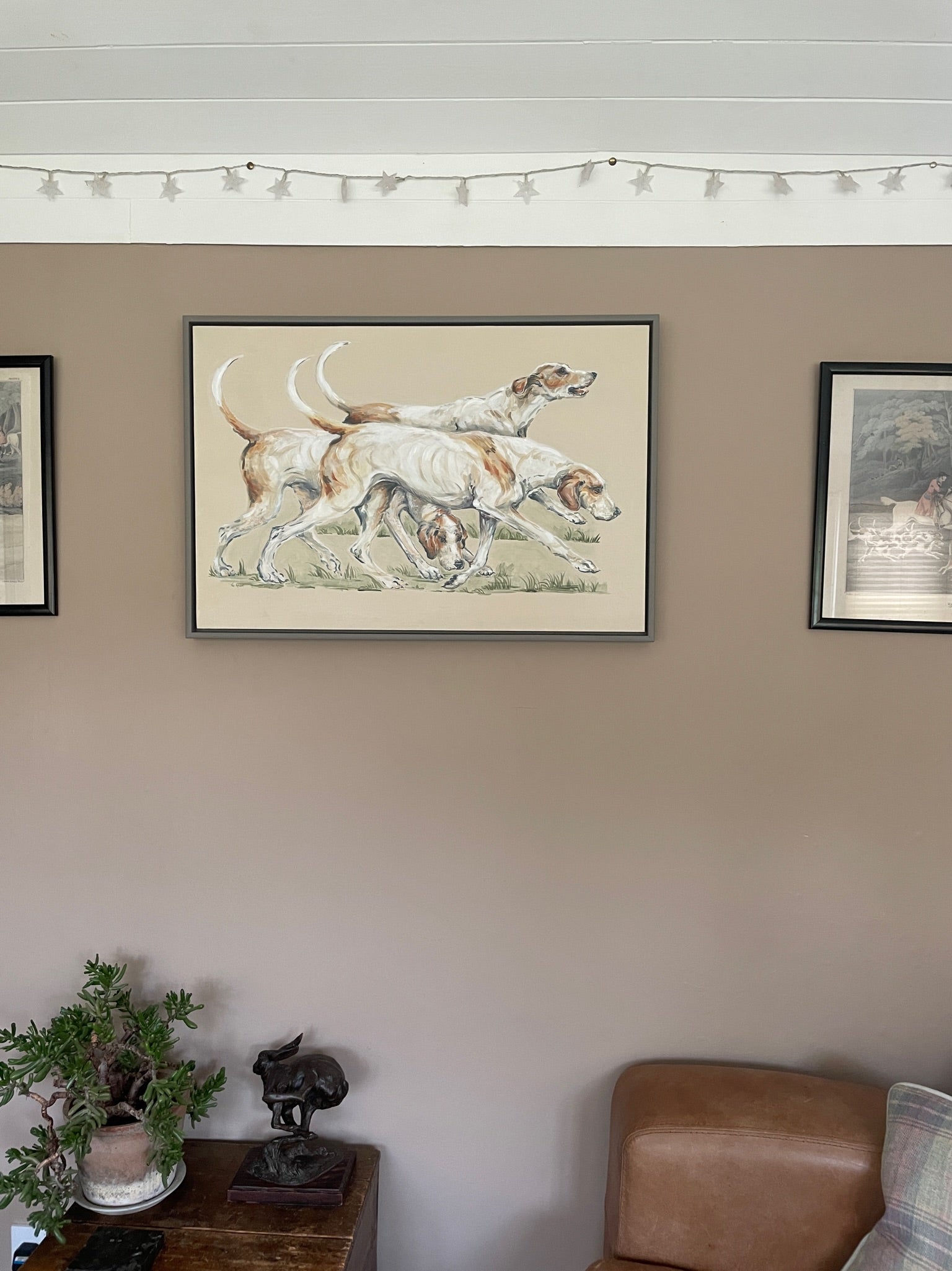 This painting shows three hounds ready to go hunting. These three each have their own characters. The background colour of the painting is a creamy beige.