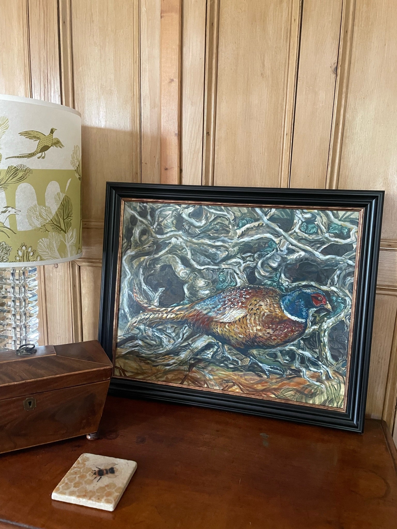 Pheasant in the hedge This painting depicts a pheasant darting through the bottom of a native hedge.