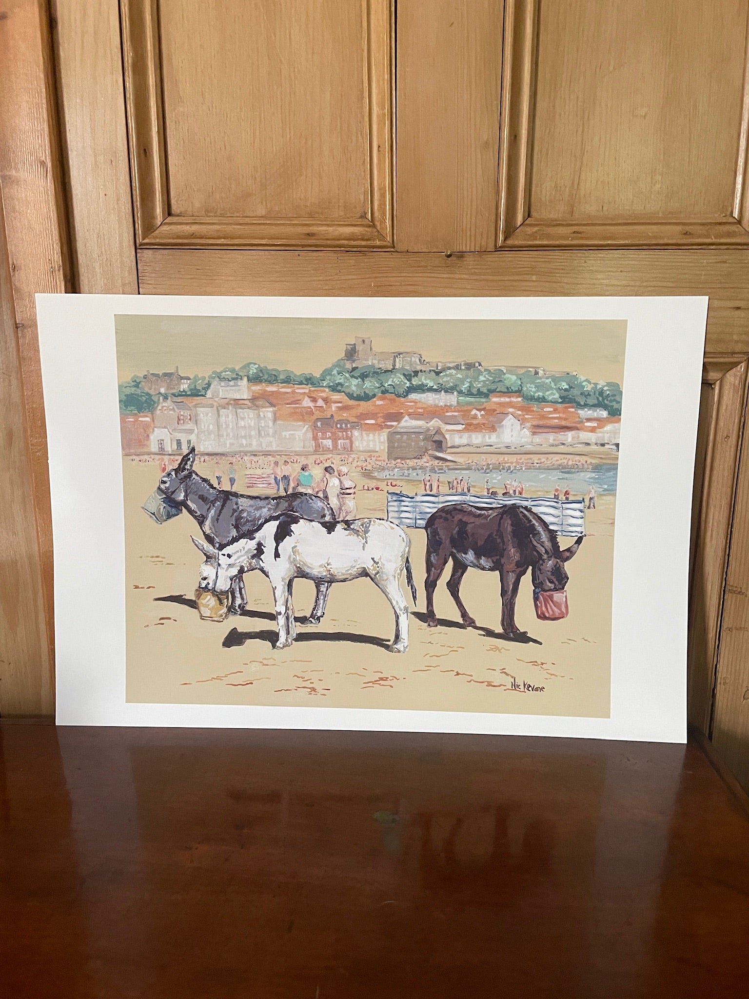 Lunchtime at Scarborough. This fine art giclee print is created from a painting of traditional seaside donkeys at Scarborough, North Yorkshire.