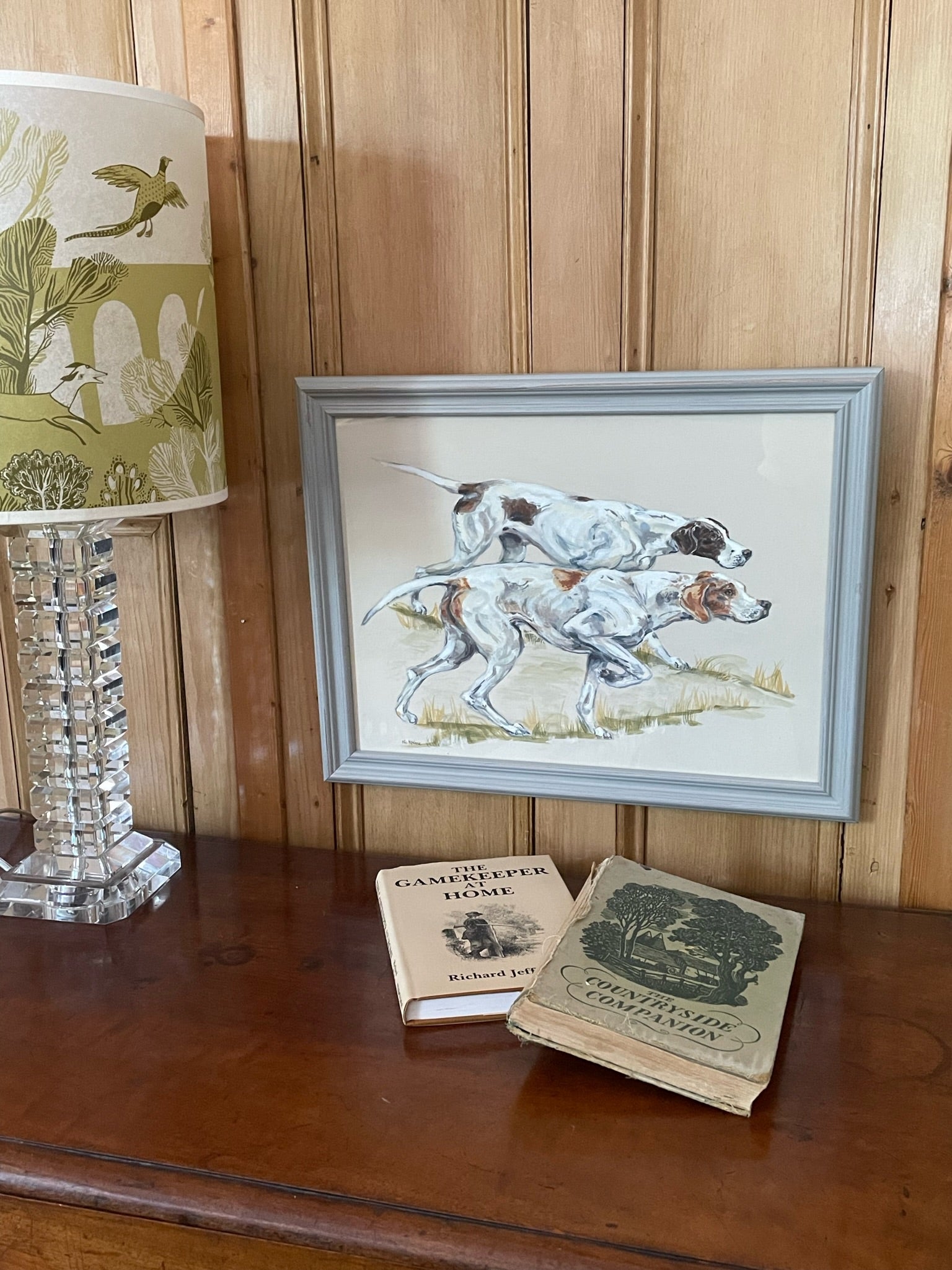 English Pointers -  two traditional gundogs hunting.  A painting of a working dog breed inspired by old country sporting prints.