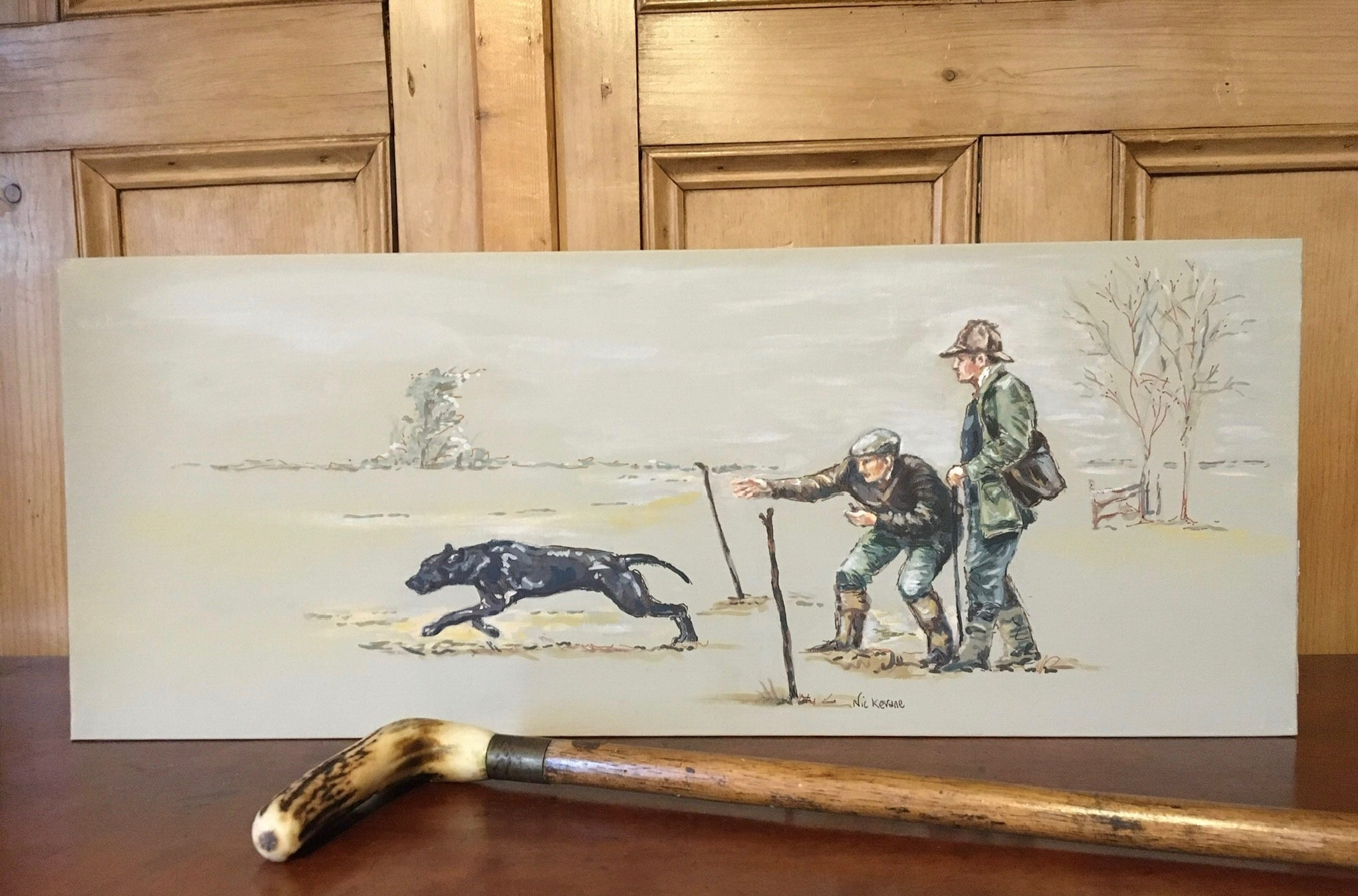 This painting depicts a gundog taking part in a working gundog test.  Canvas dummies are used and the test replicates a day shooting.  The background to this atmospheric painting is a pale neutral brown/grey.