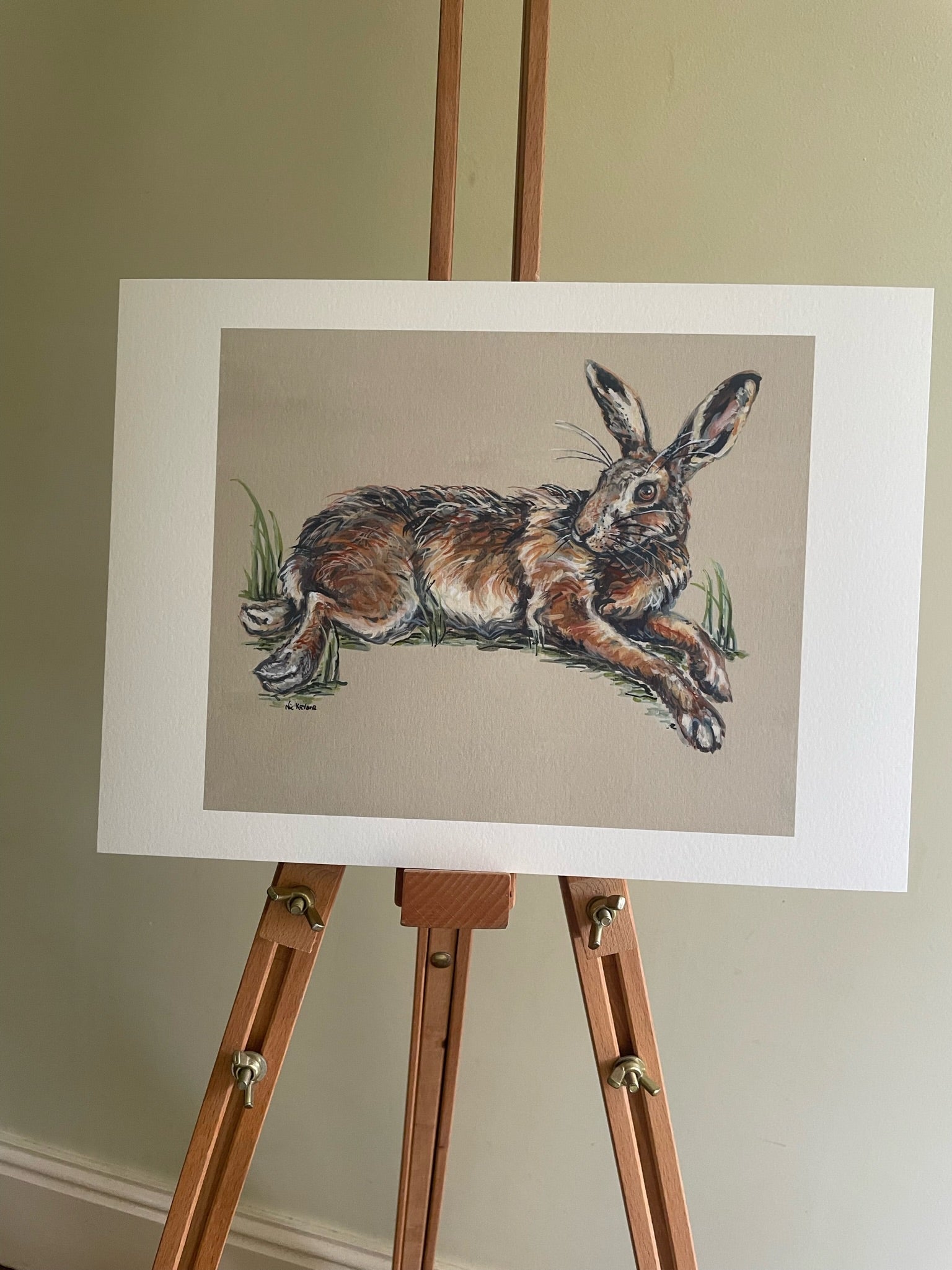 This fine art giclee print shows a hare relaxing in the warmth of the sun.  Inspired by two hares lying in a field of winter wheat in springtime.