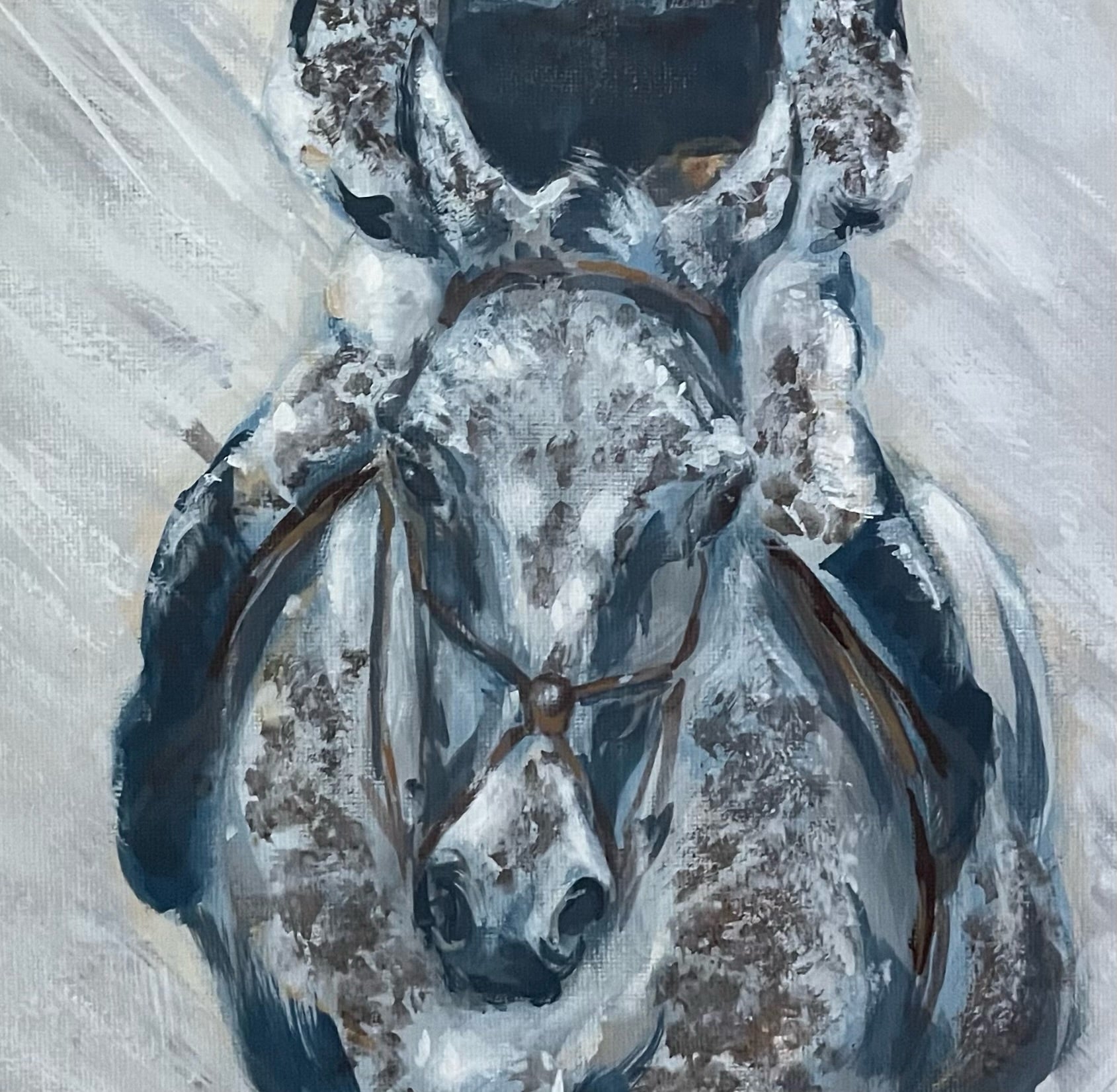 This painting is of a racehorse and jockey at the end of a very muddy and wet race. The colours are monochrome.